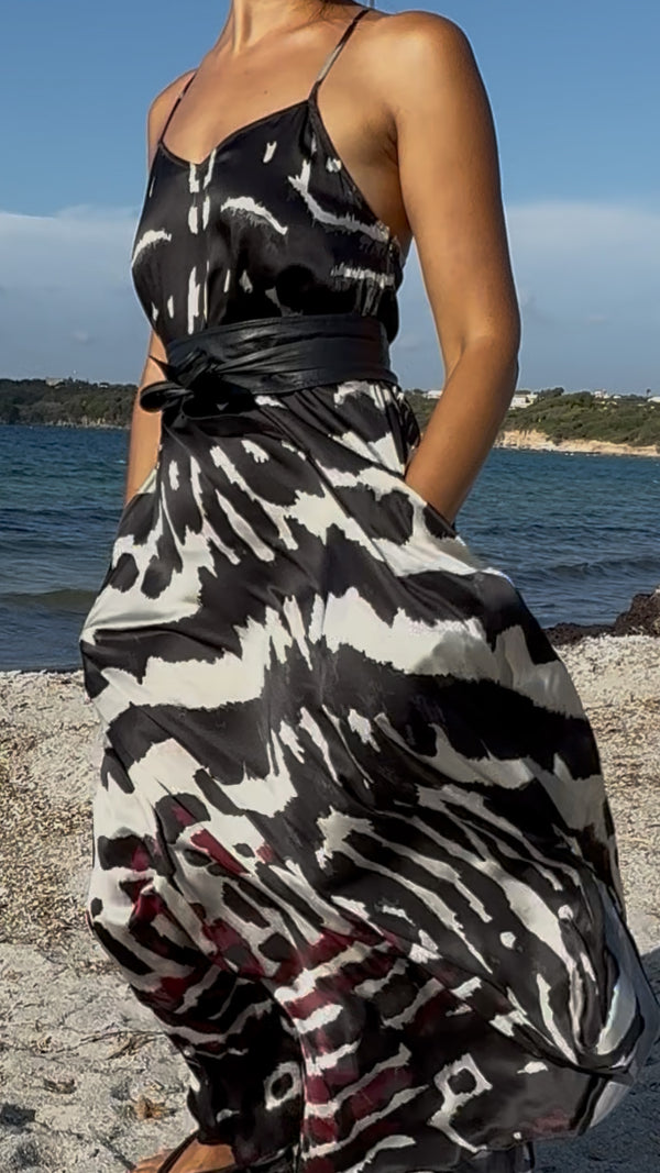 Amami Mariposa silk maxi dress styled with waist belt
