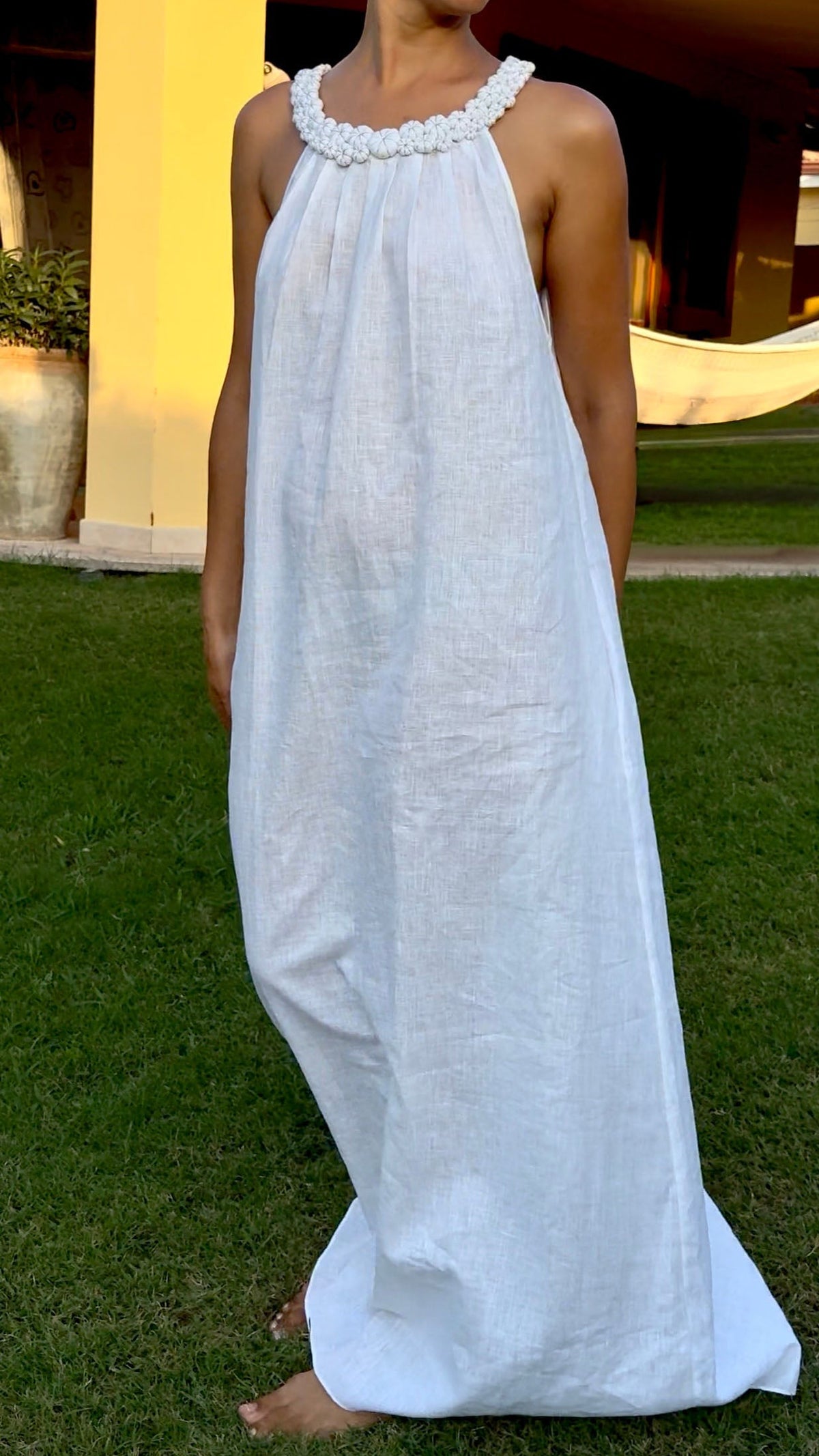 White linen maxi resort dress for summer and warm-weather escapes
