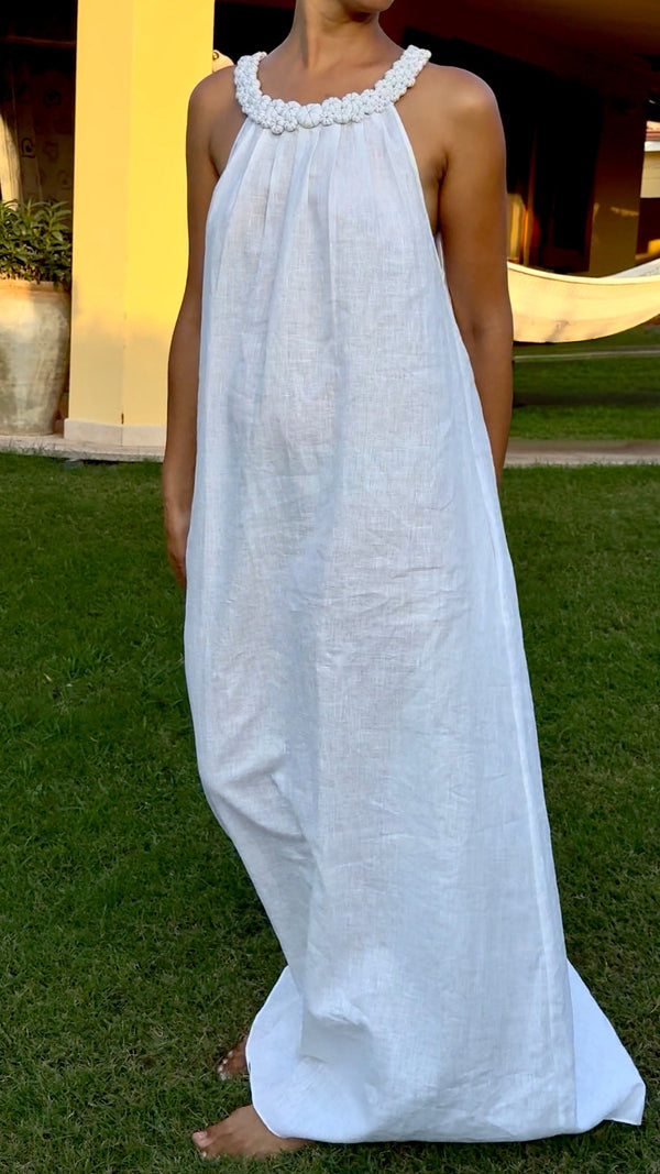 White linen maxi resort dress for summer and warm-weather escapes