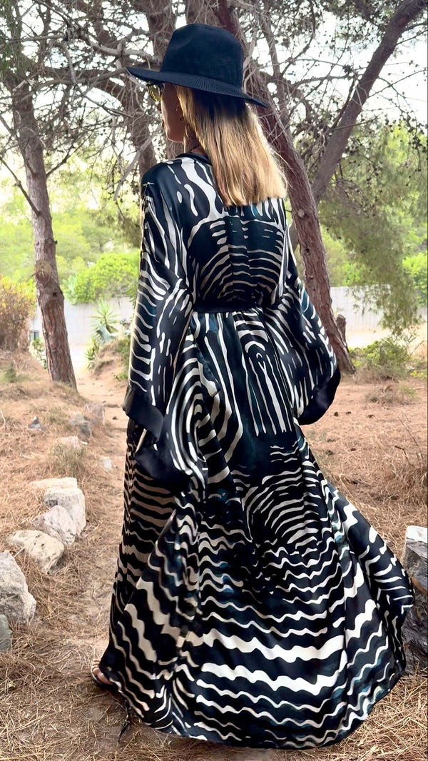 Umi Blue Fans printed silk kimono flowing in movement, back view