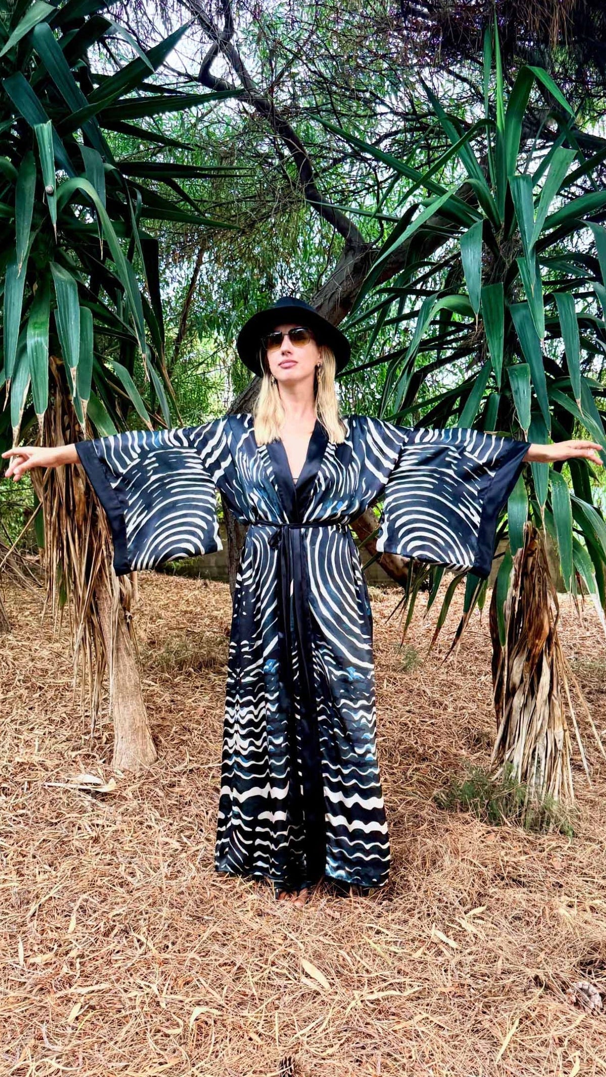 Umi Blue Fans silk kimono worn open showing wide Japanese-style sleeves